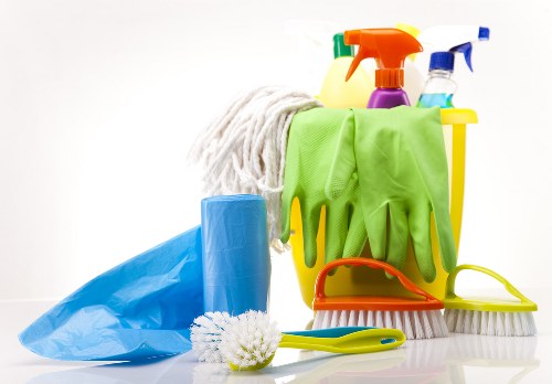 Technician performing deep carpet cleaning with professional equipment