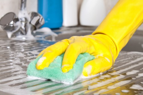 Vacuuming a mattress surface during routine cleaning