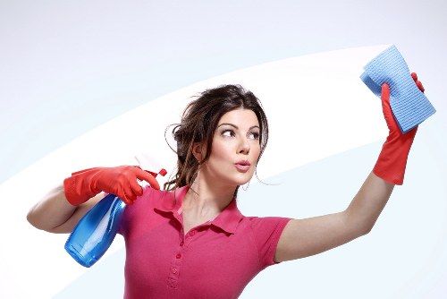 Spot cleaning a mattress stain with a cloth